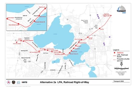 Alternative 2a LPA, Railroad Right-of-Way includes a rail alignment along railroad corridors with stations at Reiner Road/West Sun Prairie (includes Park and Ride), Lein Rd (East Towne Mall), Fair Oaks (includes Park and Ride), Union Corners, Schenck-Atwood, Baldwin St, Paterson St, Hancock St, Monona Terrace, Park St/Kohl Center, Union South, UW Medical Center, Shorewood Hills, Midvale Boulevard, HillFarms/Whitney Way, Downtown Middleton, Highways 12 and 14 (includes Park and Ride), and Greenway Station.